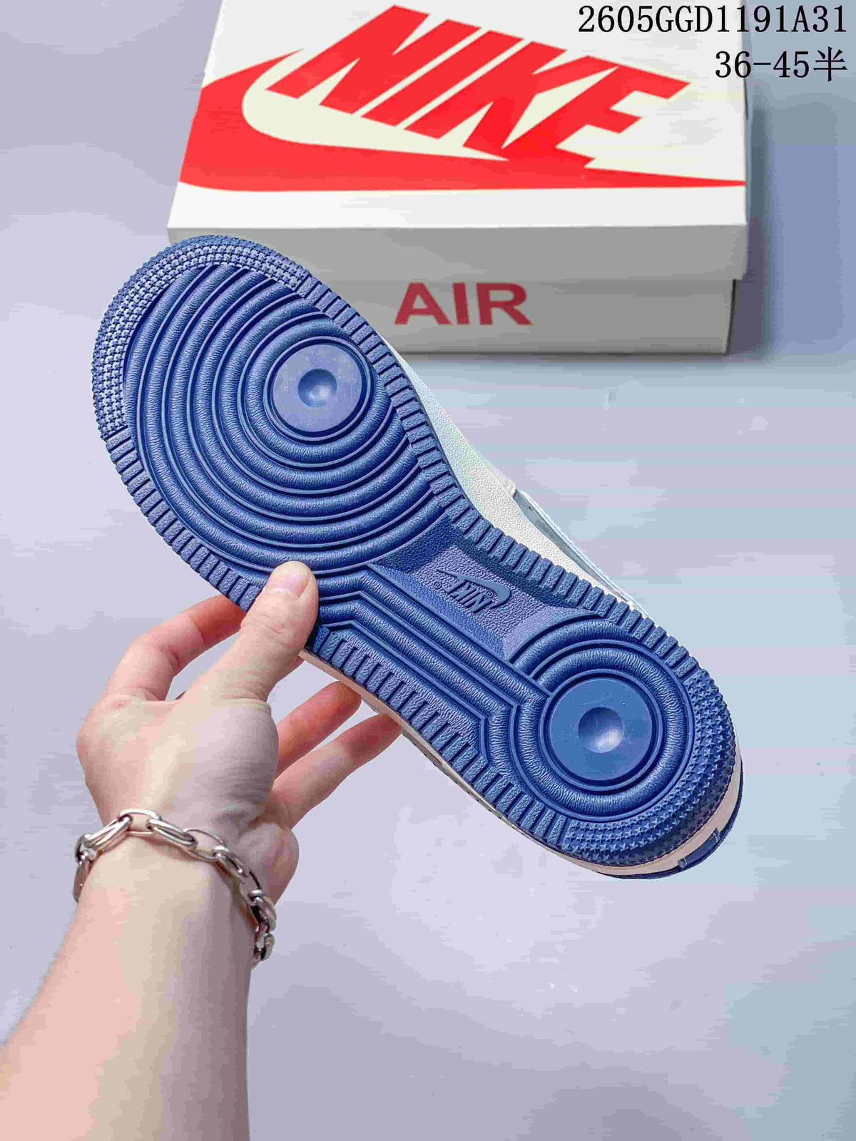 Blue outsole of the sneaker shown against a Nike Air shoe box.