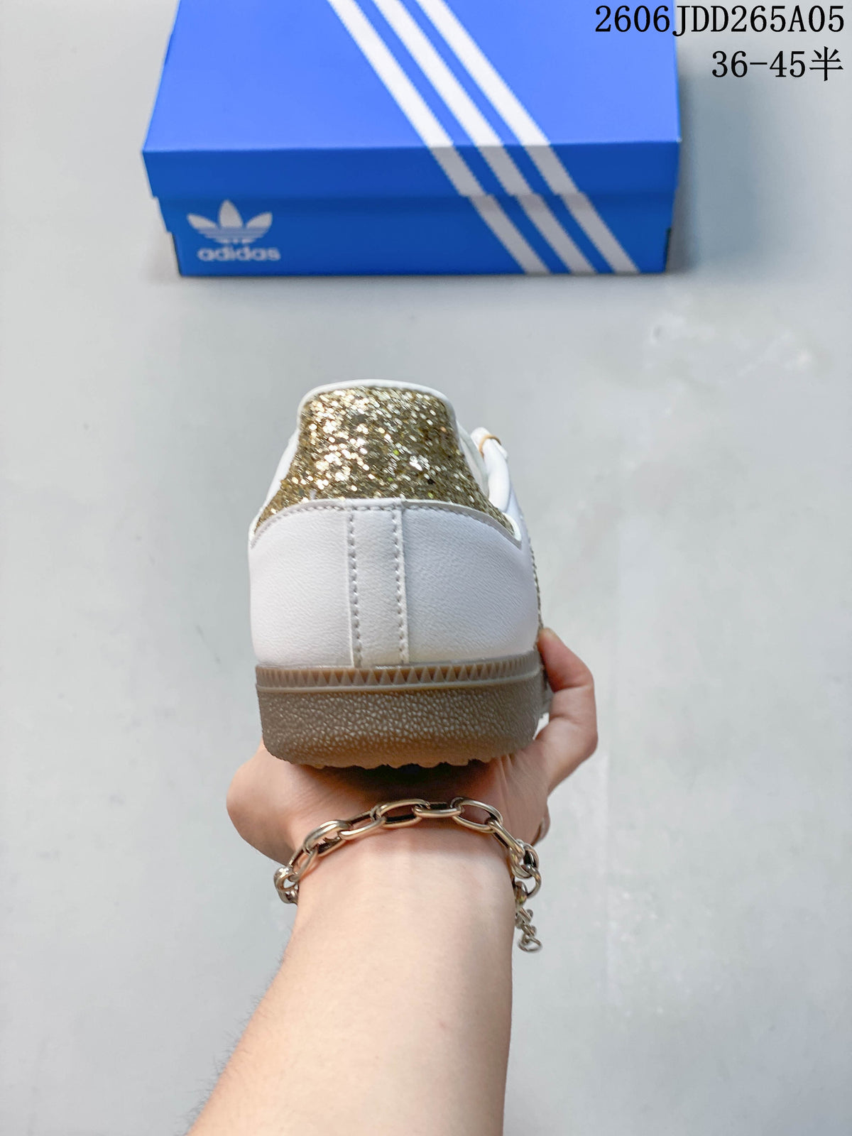 Rear view showing the white heel and gold glitter heel detail.
