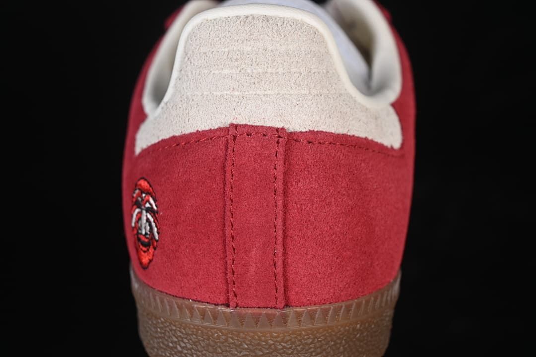 Rear close-up of red heel panel and light-colored heel tab
