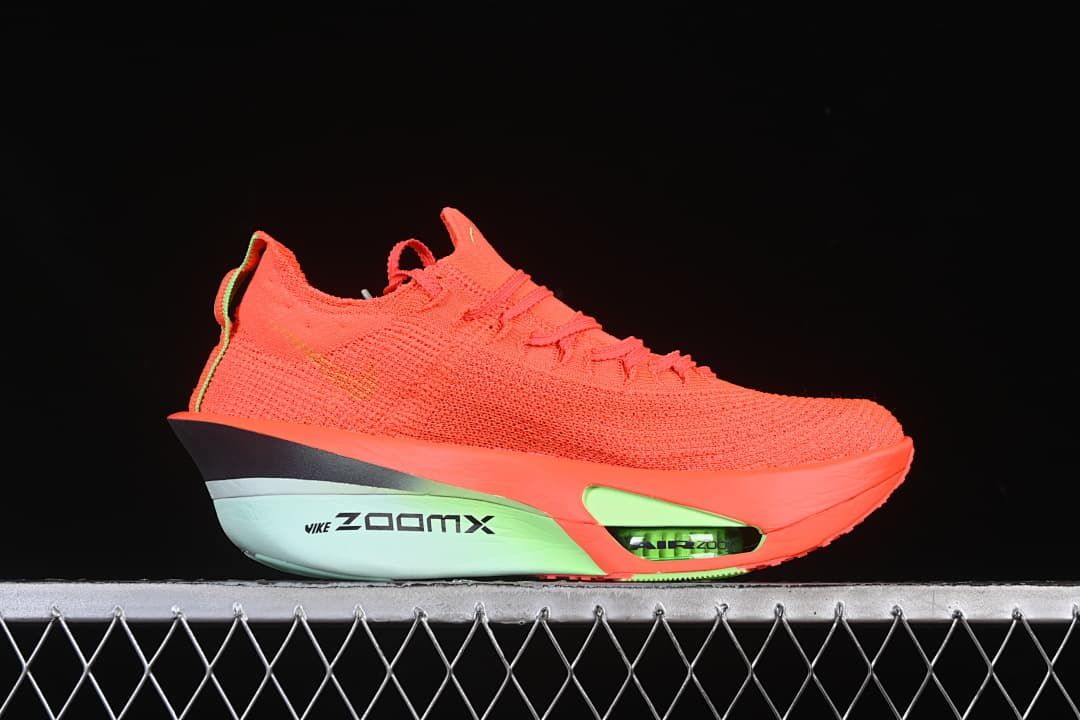 Side profile showing the knit upper, lime accents and sculpted sole.