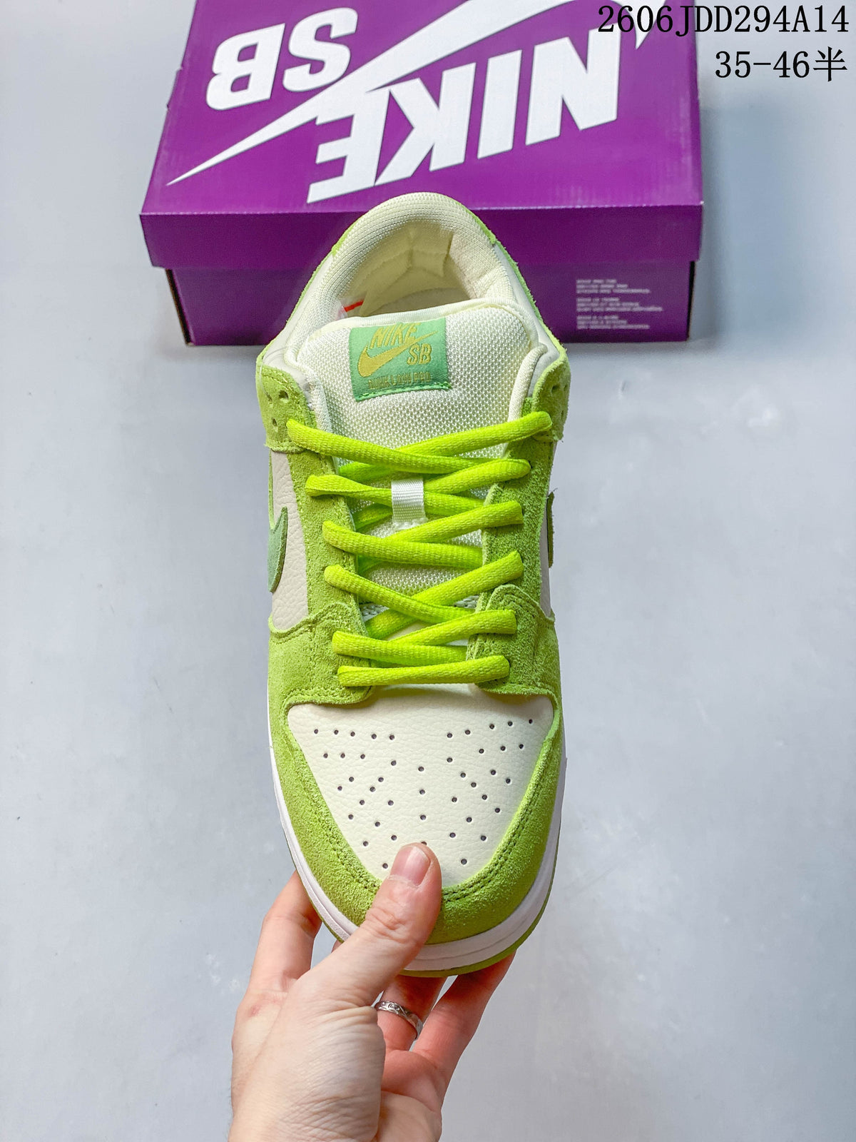 Top view showing the perforated toe, bright green laces, and tongue label