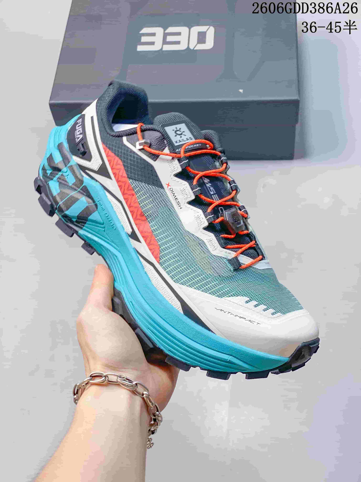 Side view of a turquoise and gray KAILAS FUGA EX330 shoe with orange laces and dark outsole lugs