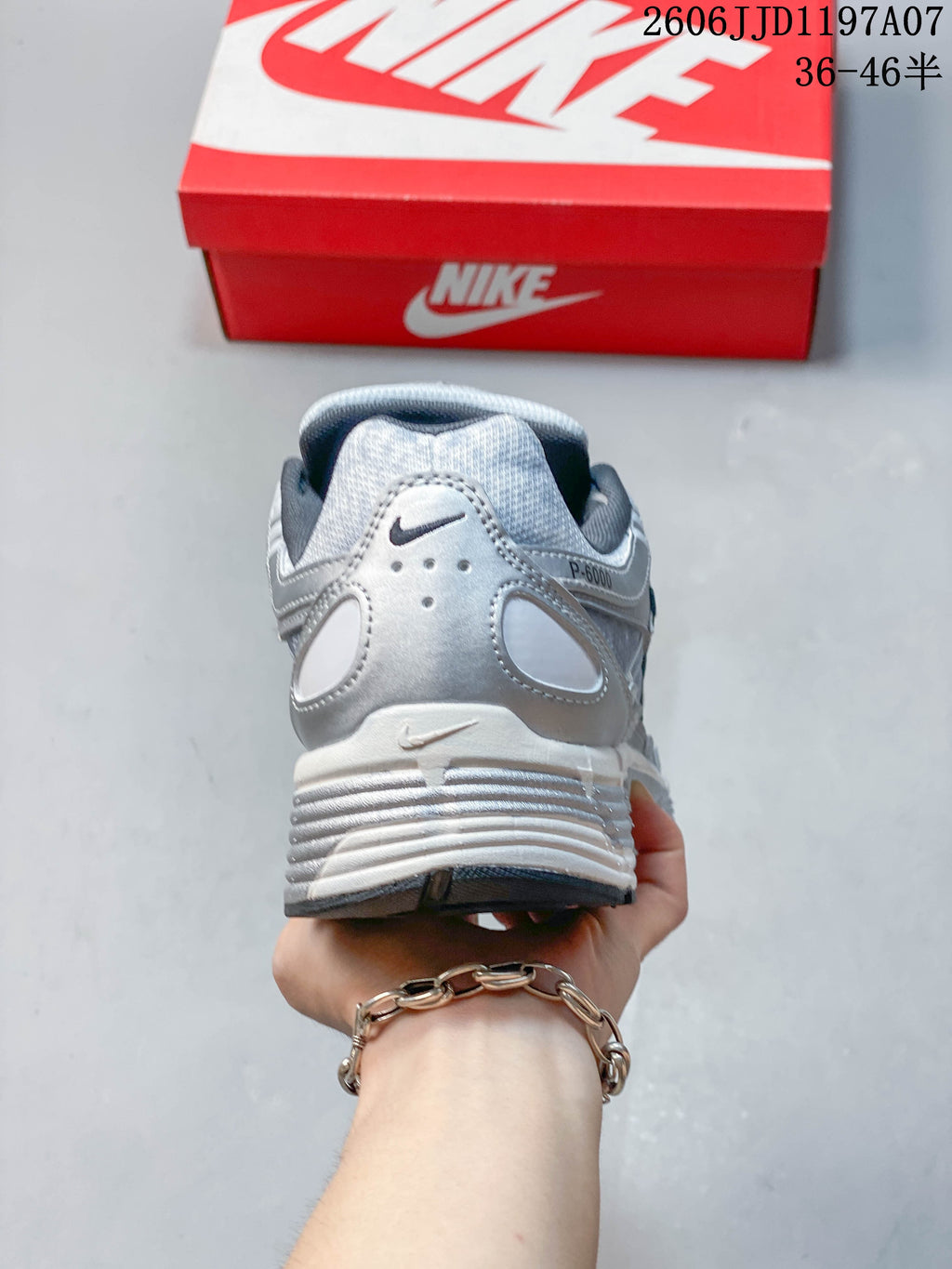 Rear view of a silver Nike P-6000 sneaker