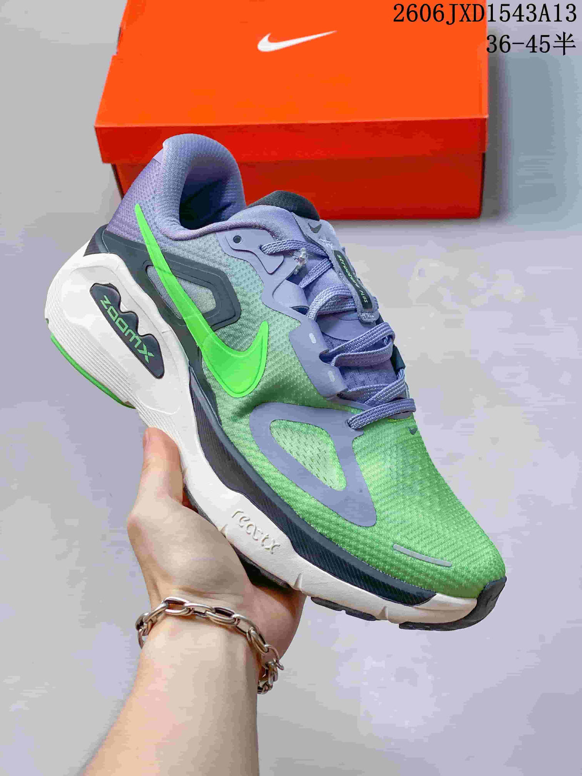 Angled side view of a green and lavender Nike Structure Plus running shoe with a bright green Swoosh.