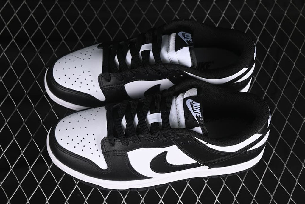 Pair of black-and-white low-top sneakers viewed from above
