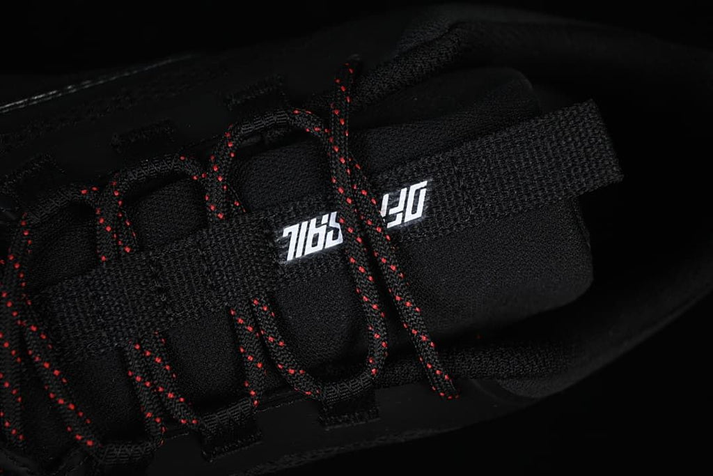 Close-up of the tongue and red-accented laces