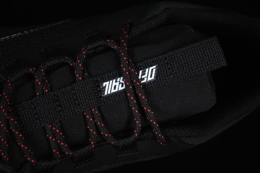 Close-up of the tongue and red-accented laces