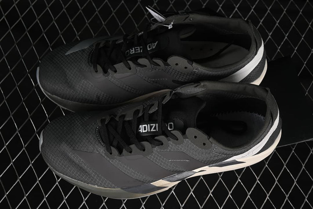 Pair of dark gray Adios 9 shoes viewed from above