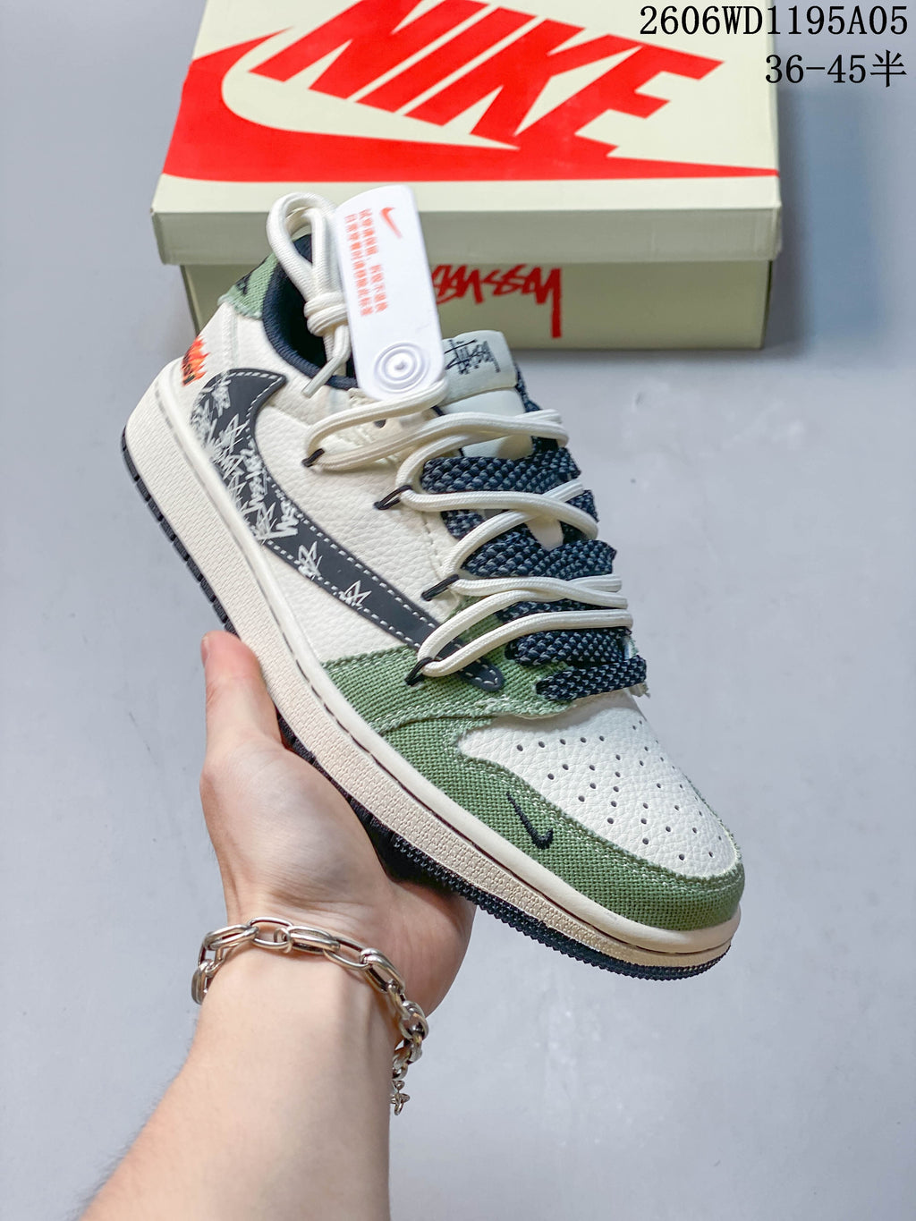 Angled side view showing white, green, and navy details
