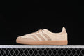 Side view of beige and cream adidas Samba OG JR9446 sneakers with woven panels and a gum-colored sole