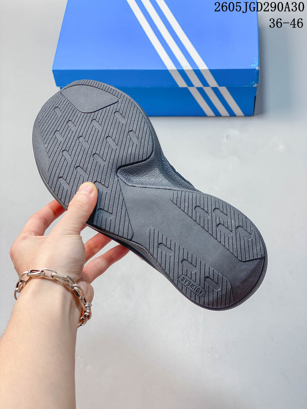 Textured outsole of a dark adidas Originals SL 72 Pro sneaker.