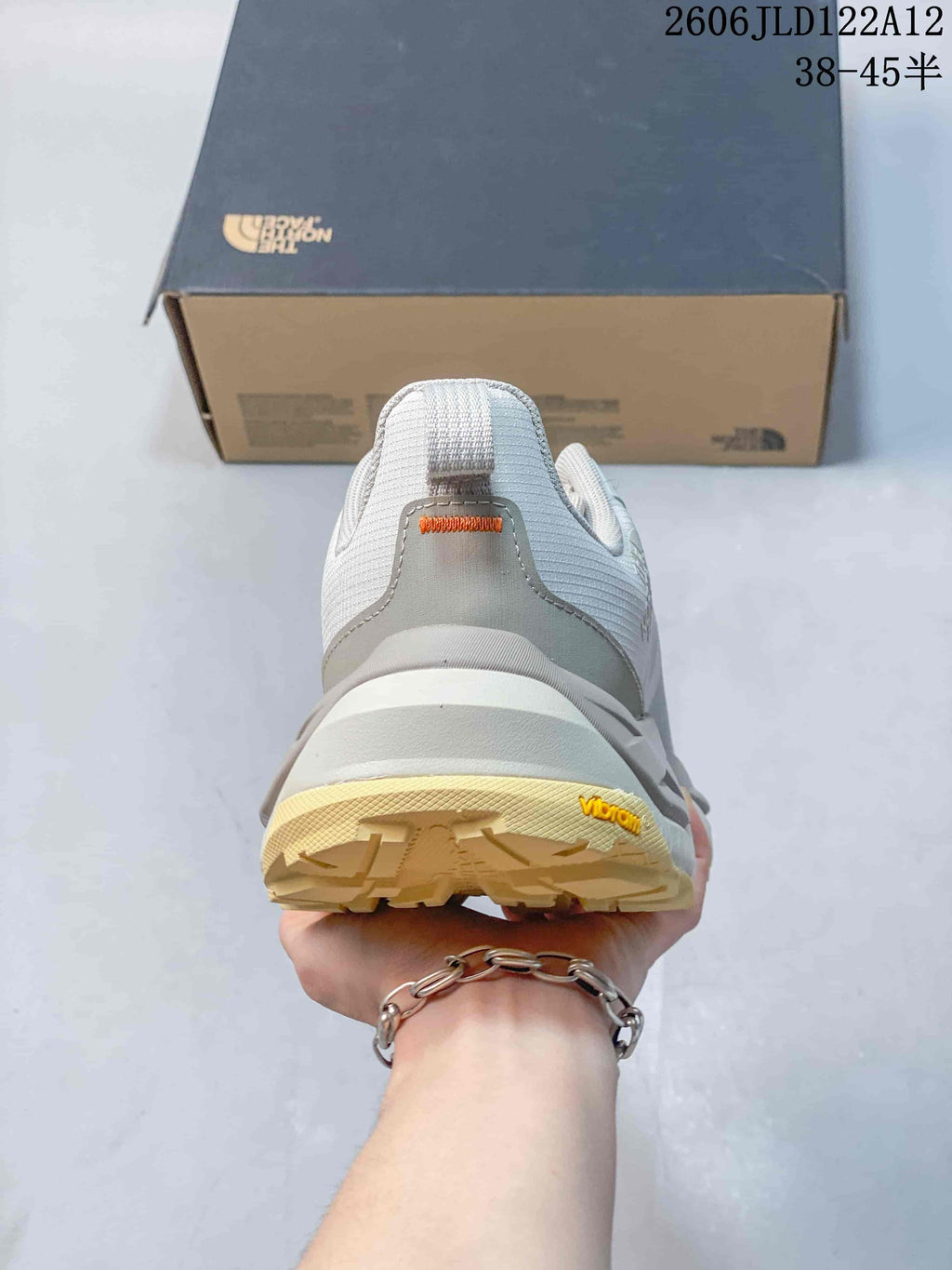 Rear view of a gray hiking shoe showing the heel and outsole.