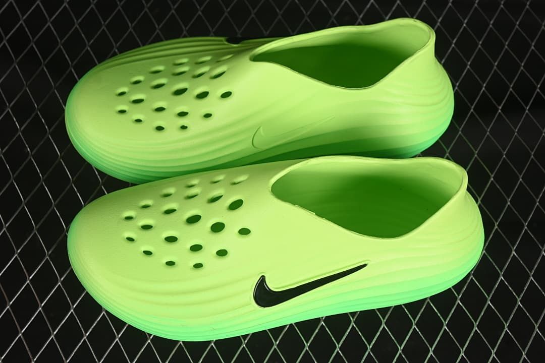 Pair of vivid green perforated clogs shown from above and the side.