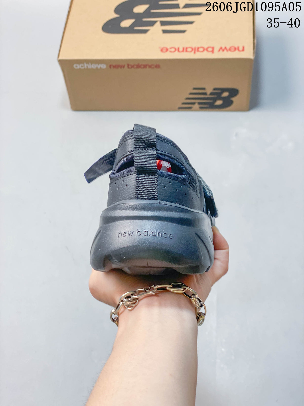 Rear view showing the heel and outsole of a gray New Balance Breeze sneaker
