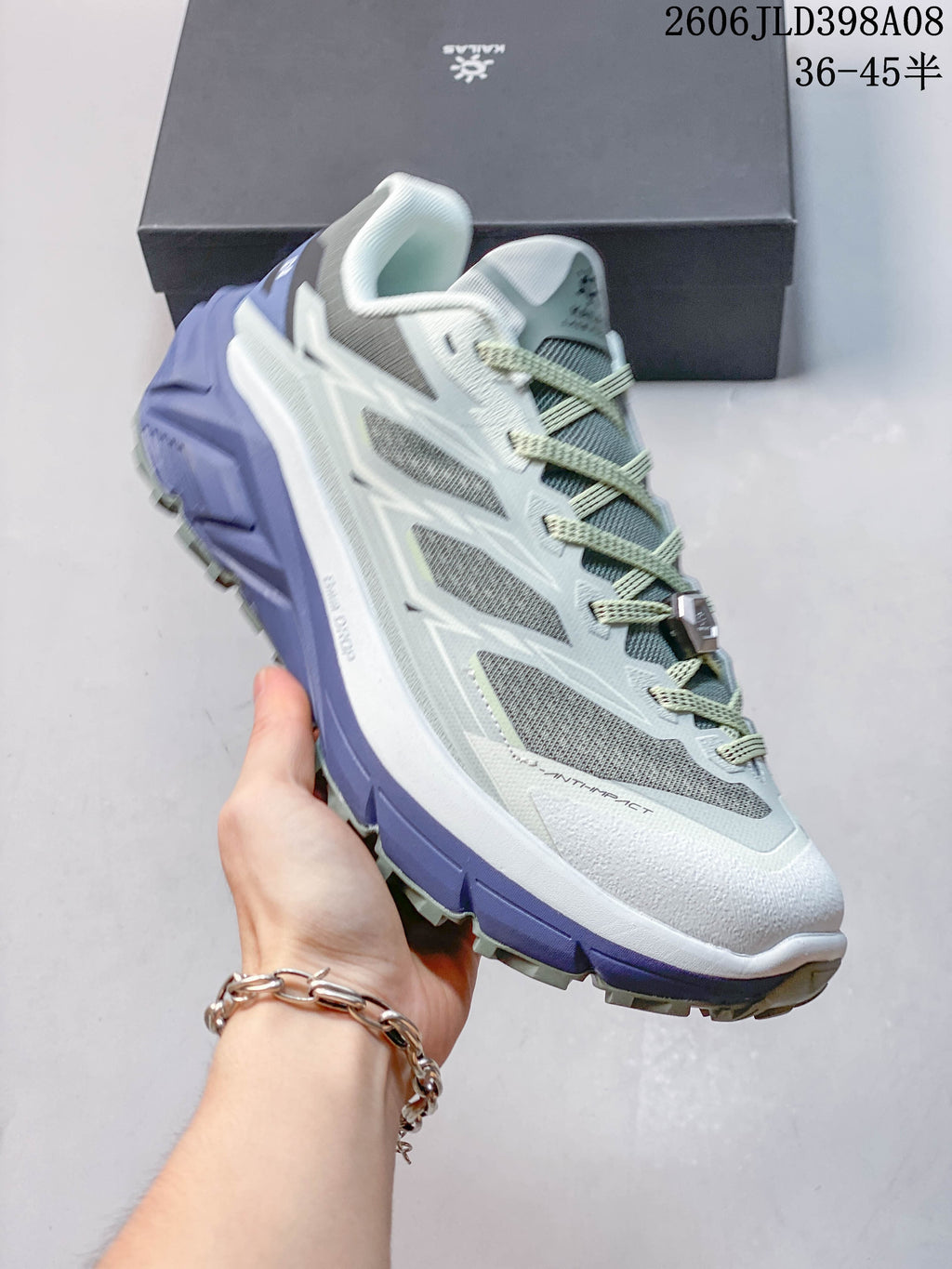 Angled view of the low-cut trail shoe showing the upper, lacing, and lugged outsole
