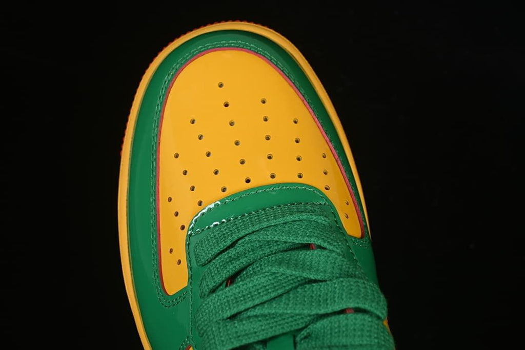 Top view of the perforated yellow toe and green laces