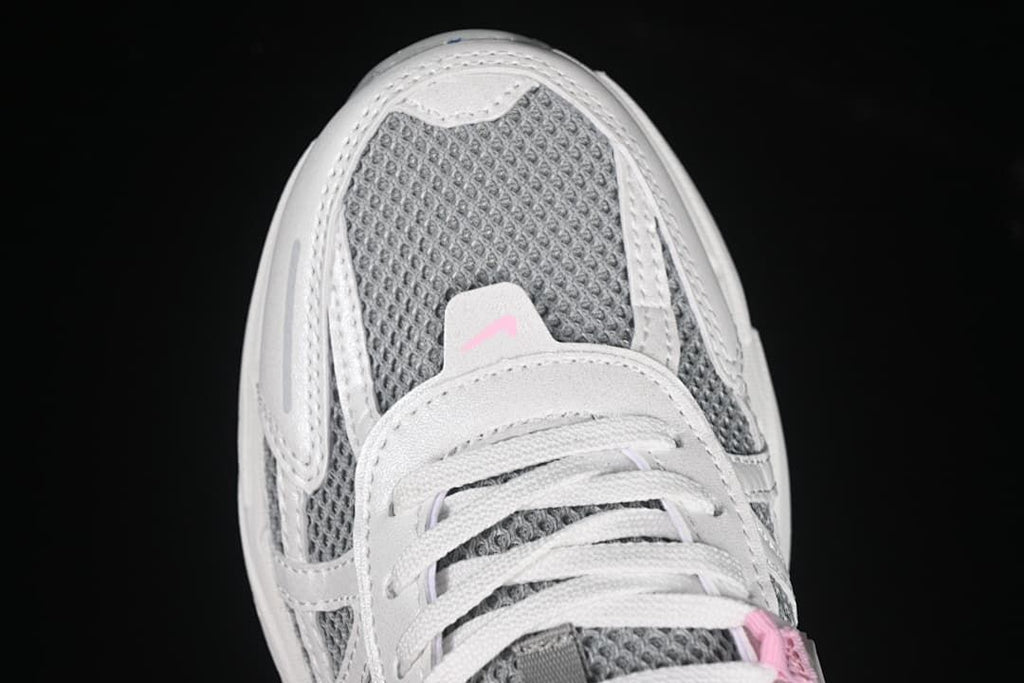 Top-front close-up showing gray mesh-look panels and white laces