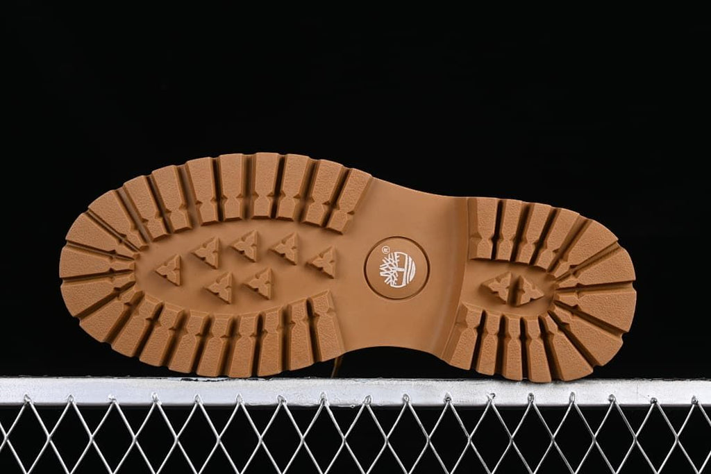 Underside of the boot showing the lugged outsole tread