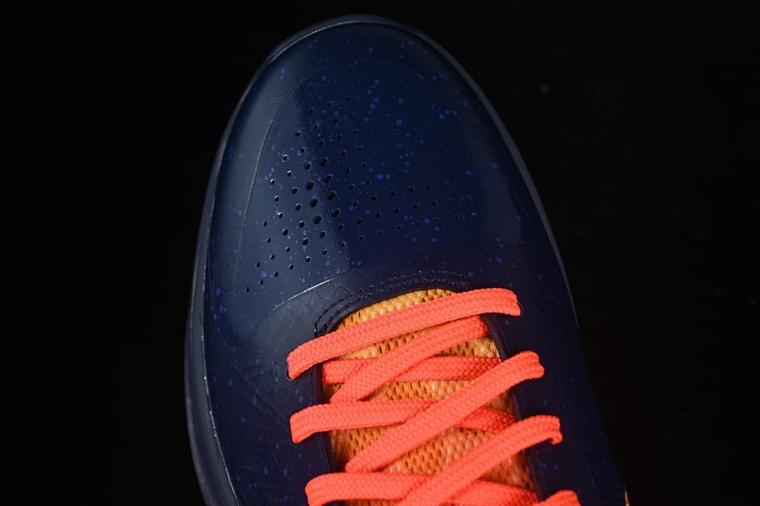 Top view of the perforated toe and coral laces.