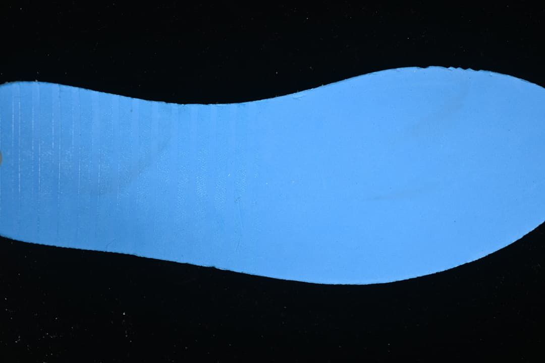Blue-lit view of the sneaker outsole