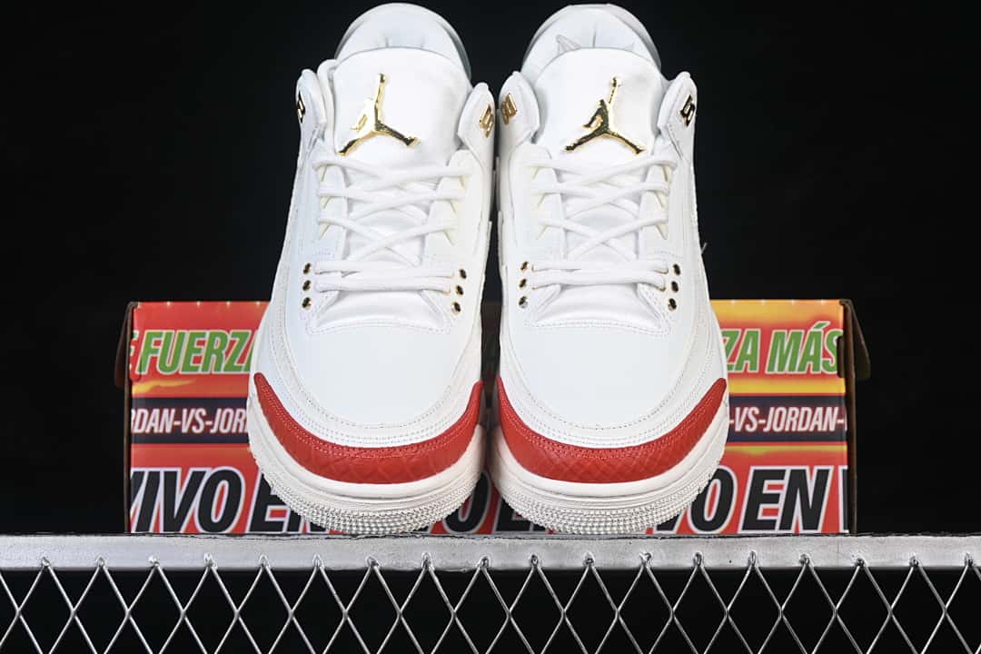 Front view of both sneakers showing white uppers and red toe accents