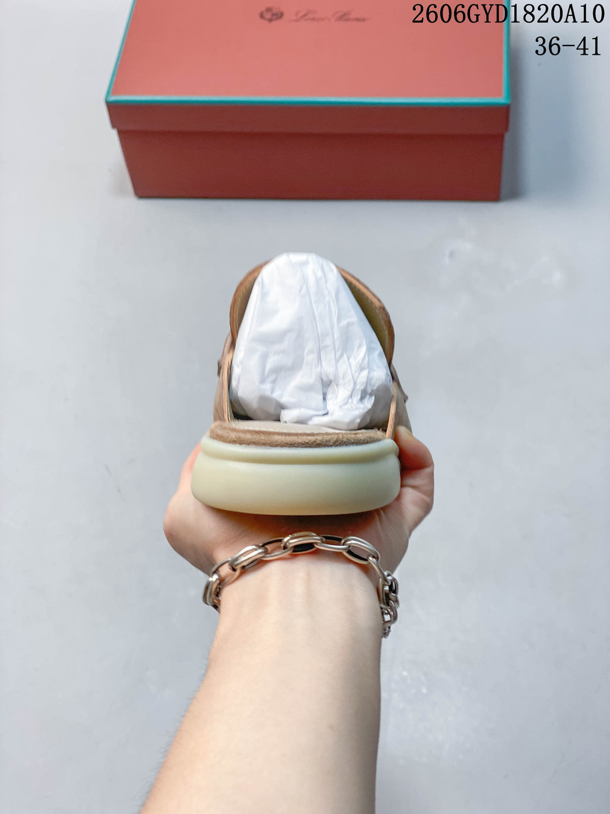 Rear view showing the open-back mule design and light-colored sole