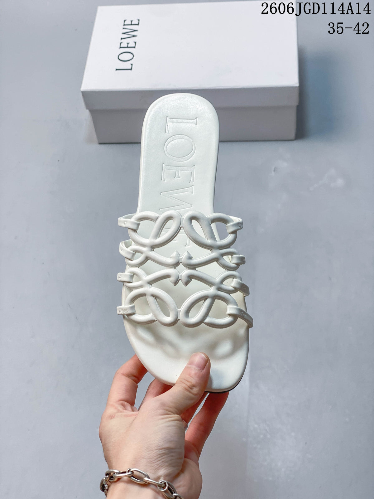 Top view of a white slide sandal with a square toe and interlaced straps