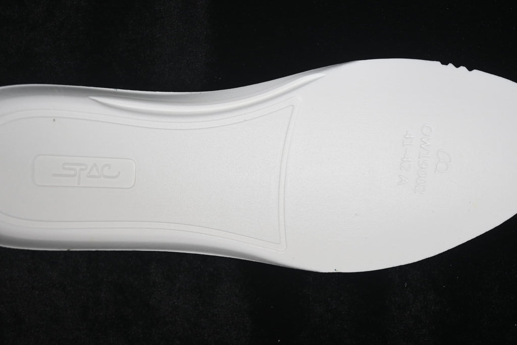Close-up of the white outsole with molded markings