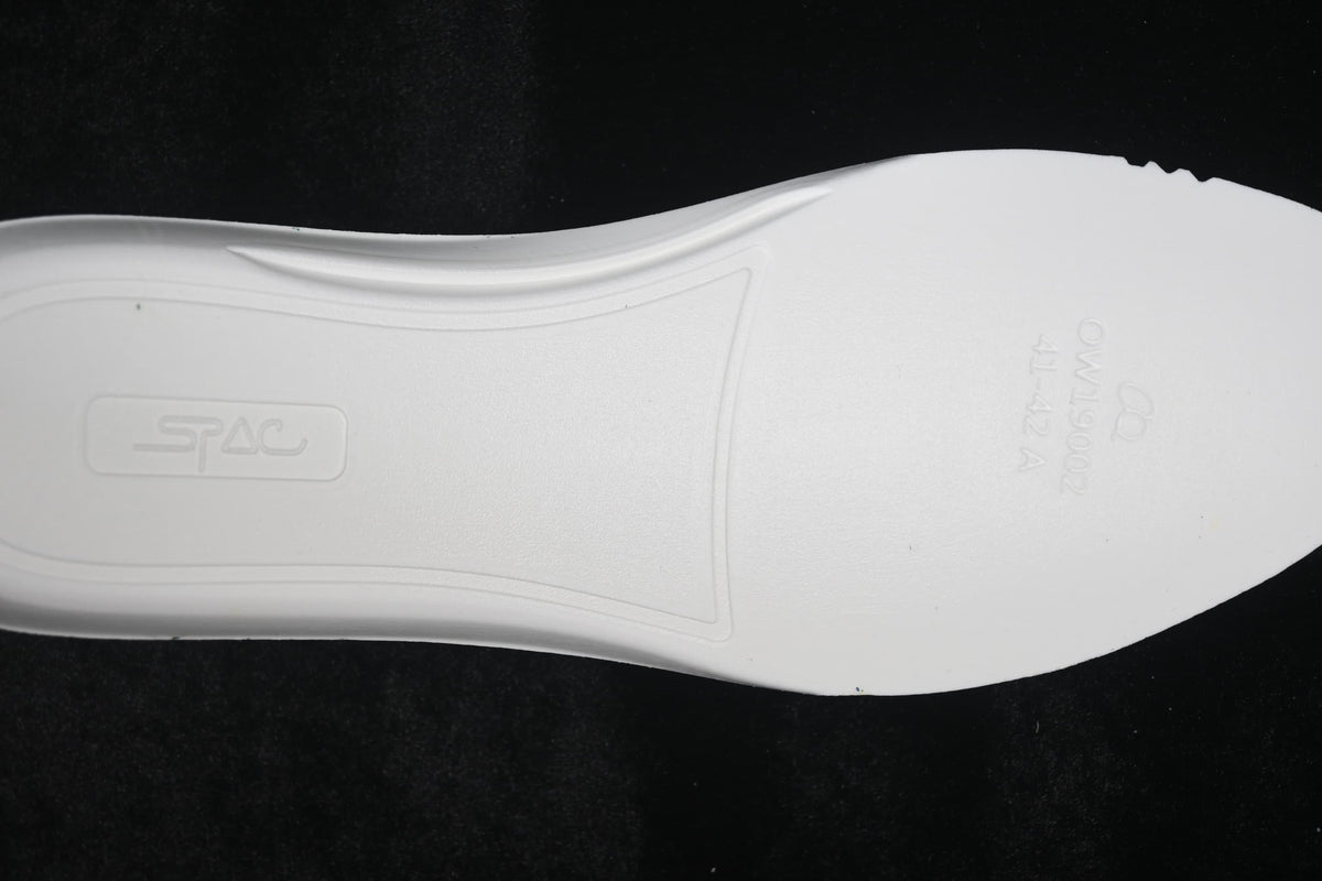 Close-up of the white outsole with molded markings