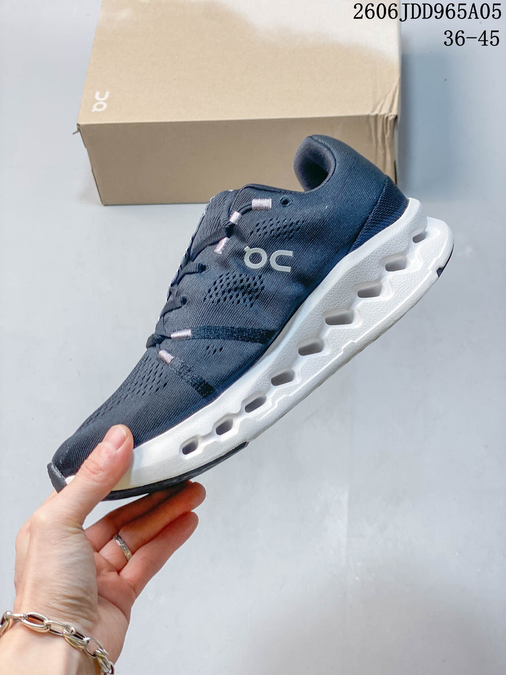 Side view showing the perforated upper and sculpted white sole