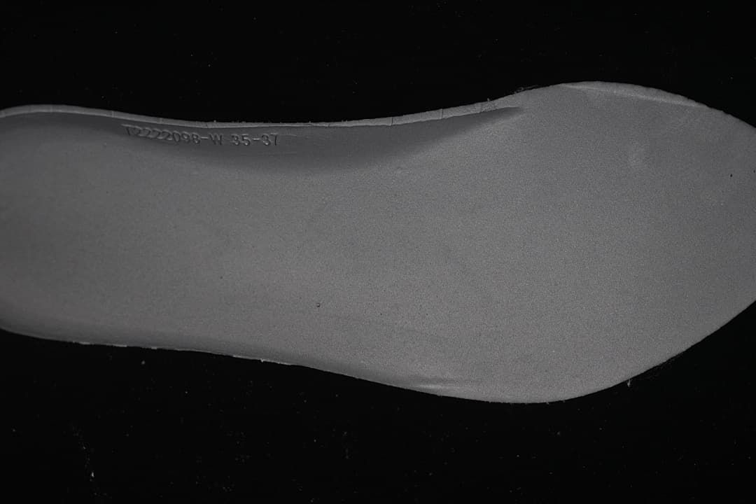 Close-up of the shoe sole with embossed size and product markings