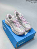 Pair of silver-toned HOKA Mafate Speed shoes with pink laces and accents, shown on a blue shoebox