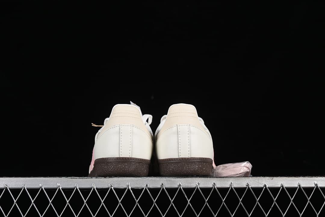 Rear view of the sneakers showing heel panels and dark soles
