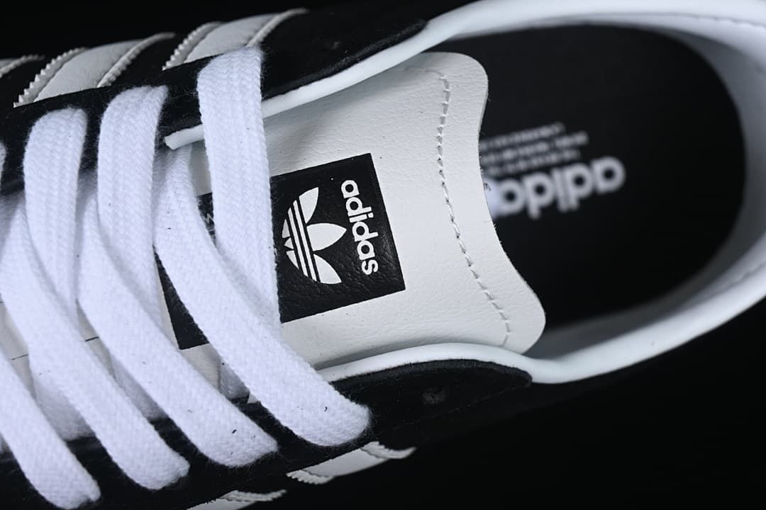 Close-up of the tongue, laces and adidas branding