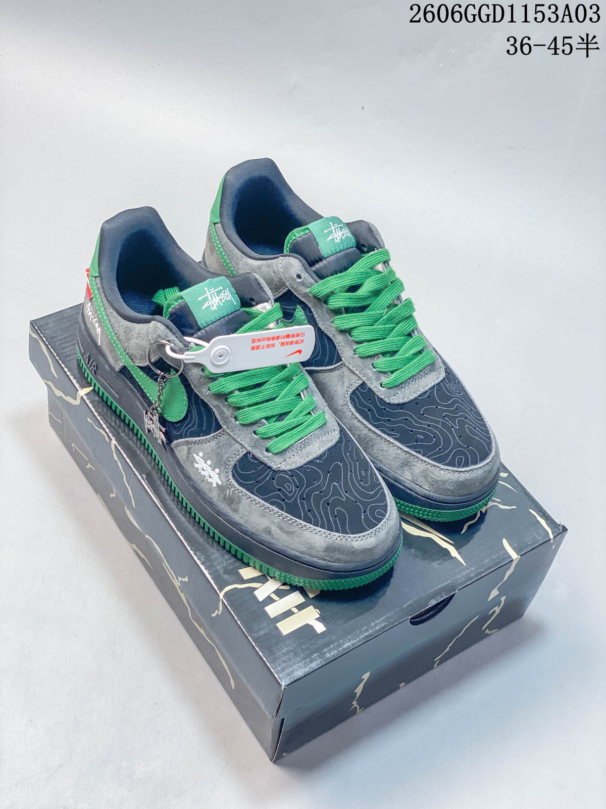 Nike Air Force 1 low-top sneakers in gray, navy, and green, shown from the front
