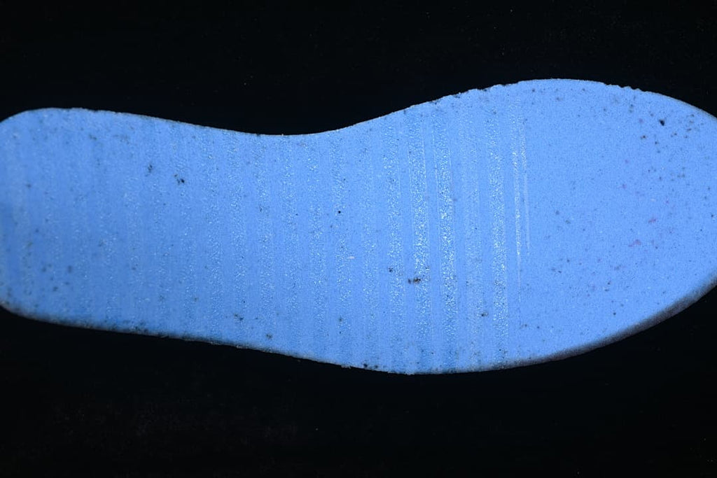 Close-up of a blue-lit shoe insert.