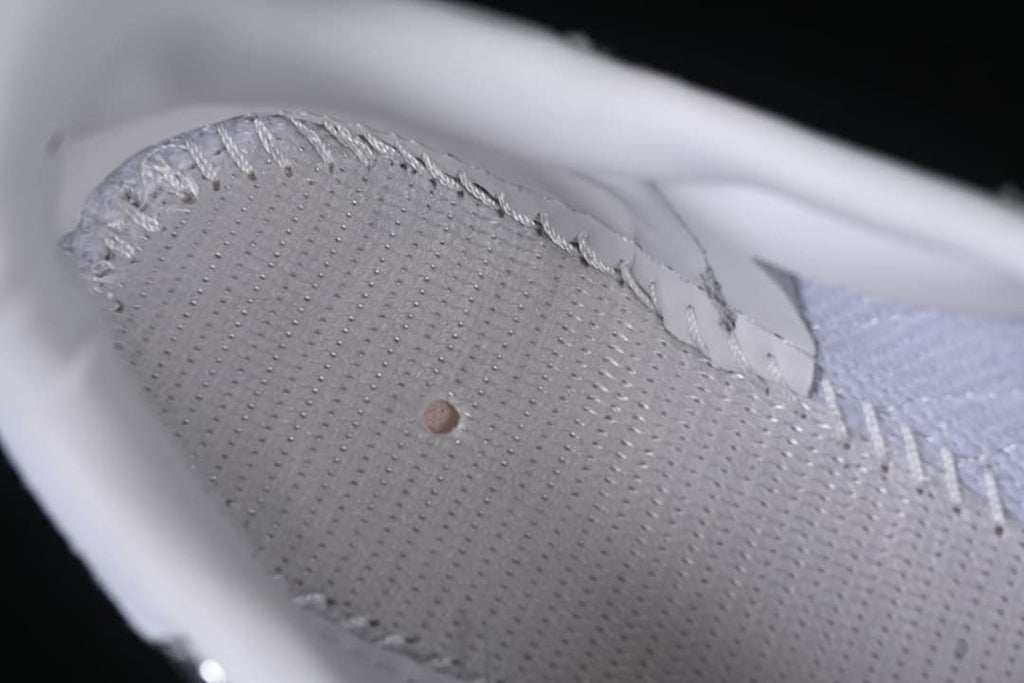 Close-up of the shoe's interior footbed and stitching