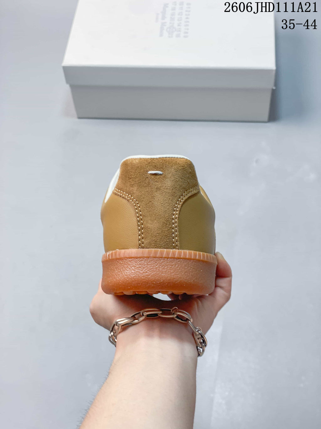 Rear view showing the tan and suede-textured heel panels