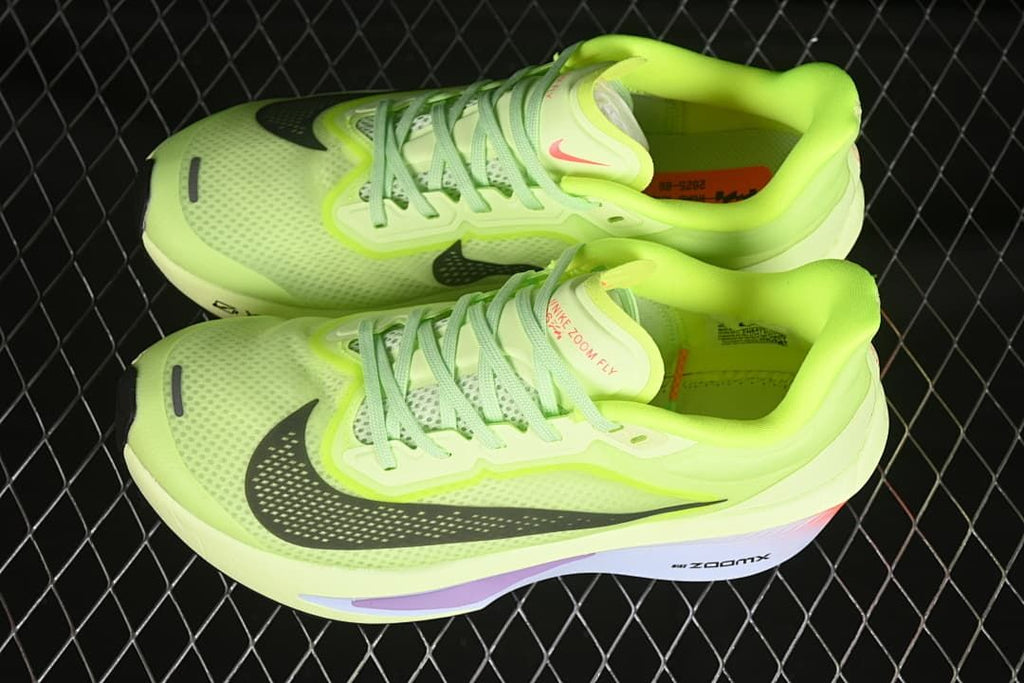 Pair of volt green Nike Zoom Fly 6 shoes viewed from above and the side.