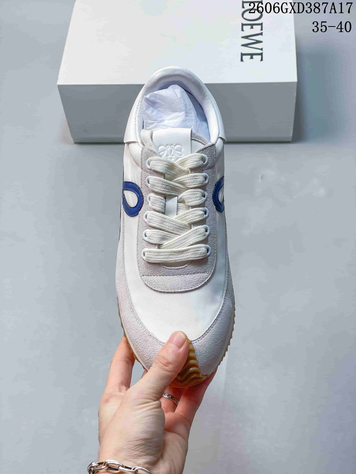 Front view of the sneaker showing the laces and color-block upper