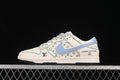 Side view of an off-white low-top sneaker with a light blue swoosh, green monogram-style graphics and contrast stitching