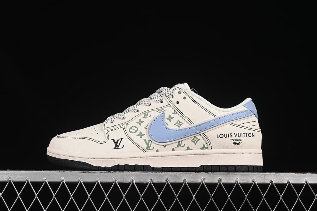 Side view of an off-white low-top sneaker with a light blue swoosh, green monogram-style graphics and contrast stitching