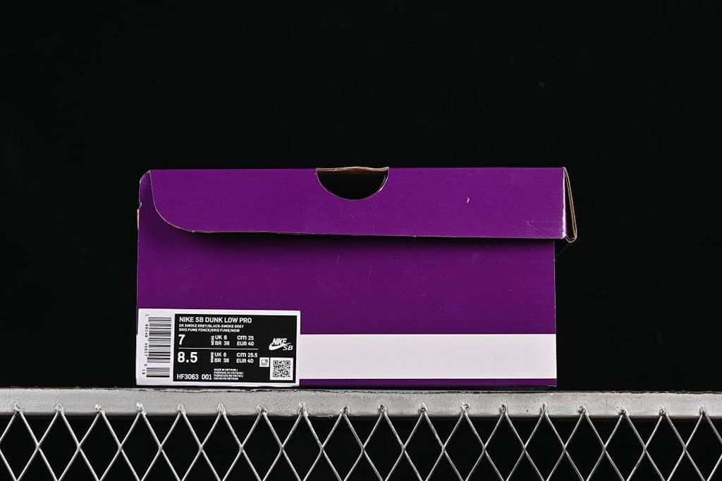 Purple shoe box with a product label showing Nike SB Dunk Low Pro and size information