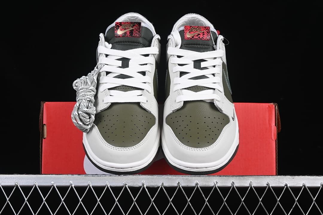 Front view of the pair with white laces and olive perforated toe panels.