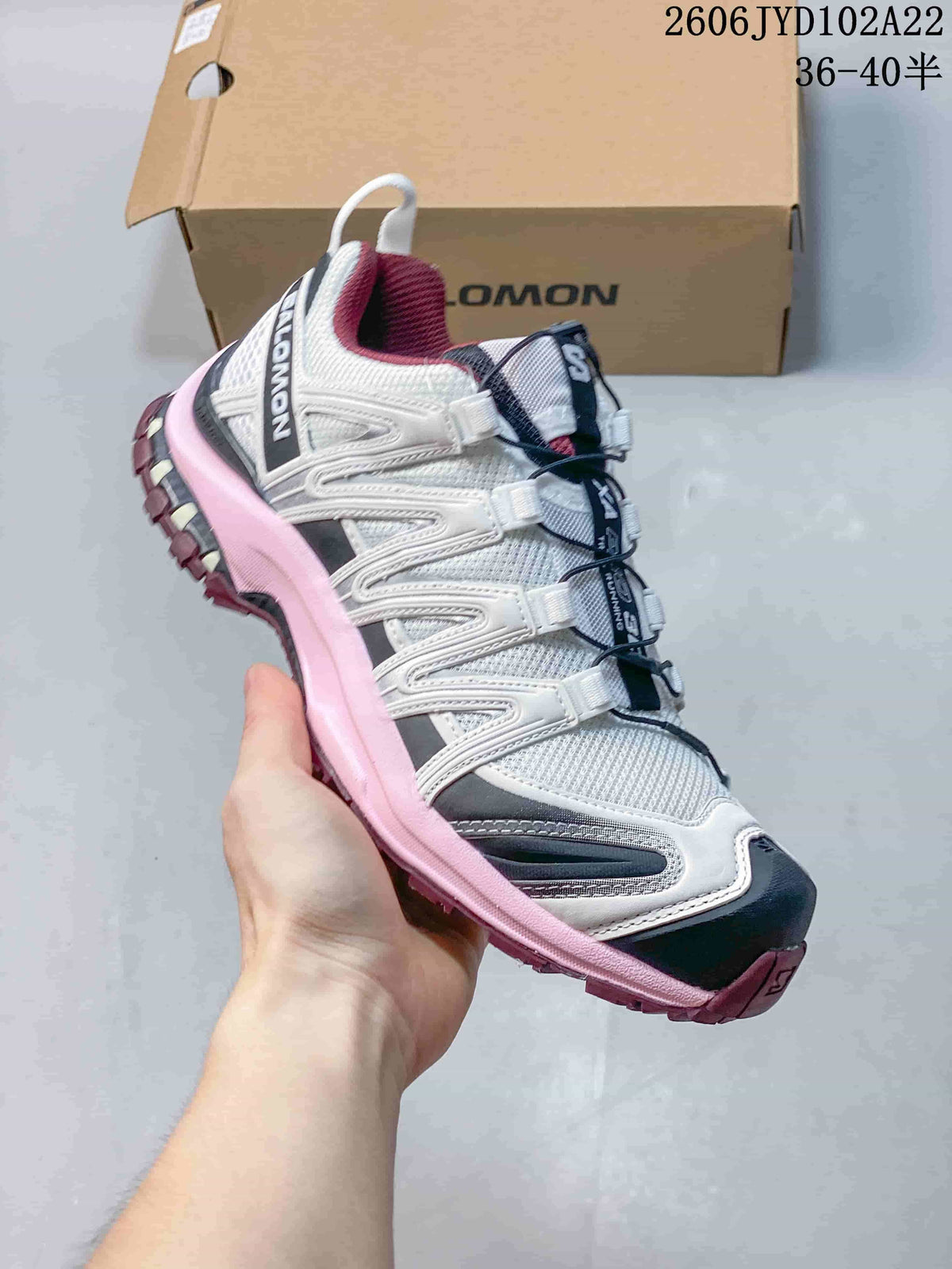 White Salomon XA Pro 3D sneaker with pink accents and toggle lacing