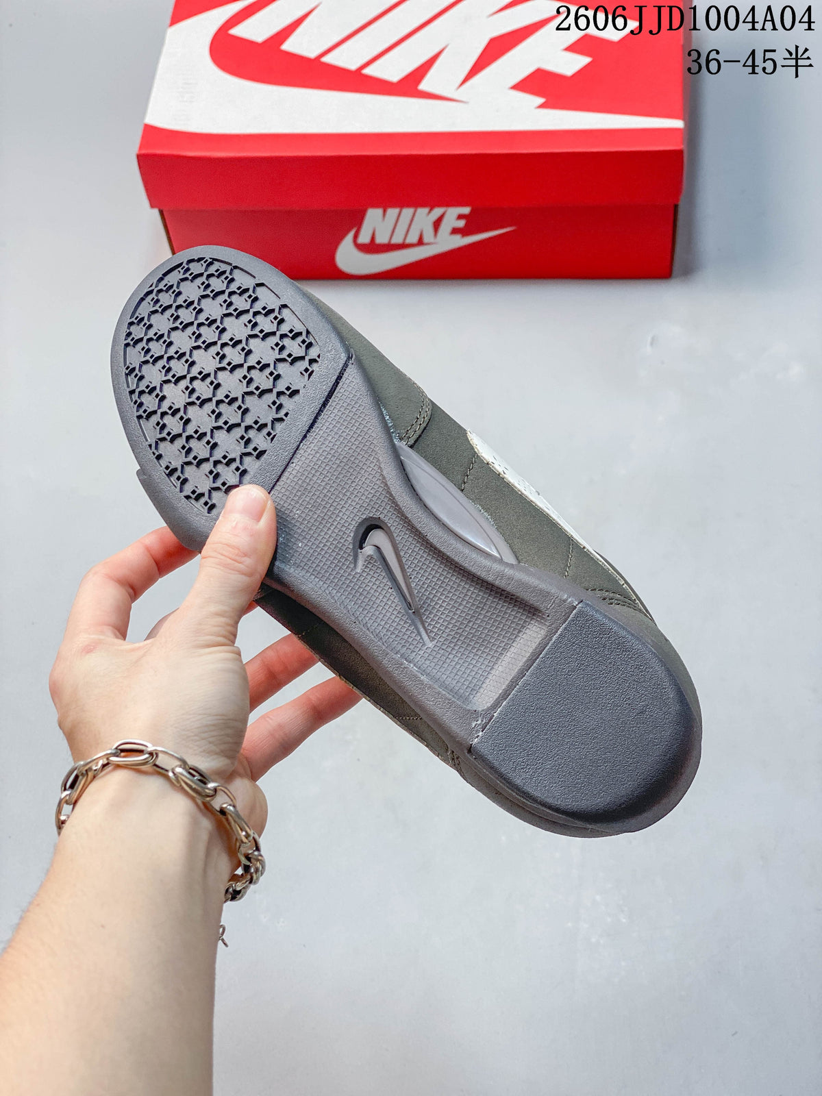 Close-up of the gray outsole and tread on a Nike Sprint Sister sneaker