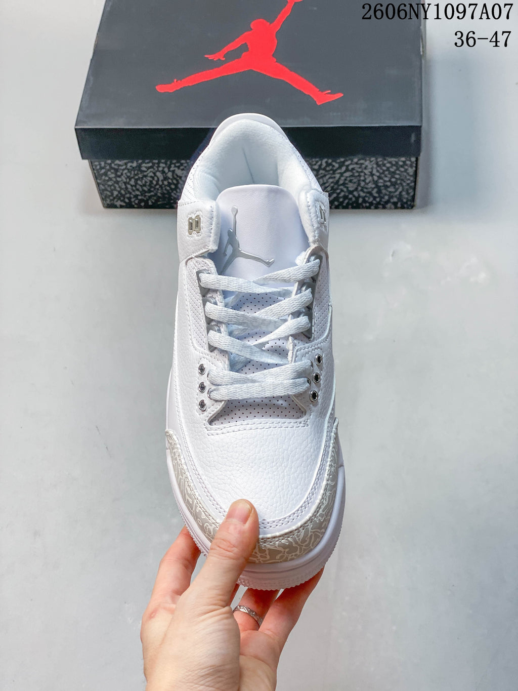 Front view showing the laces and perforated details