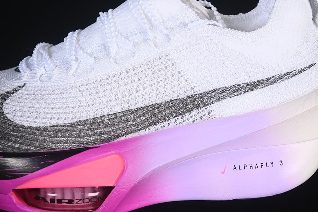 Detail of the knit-look upper, dark Swoosh and pink-to-lilac midsole.