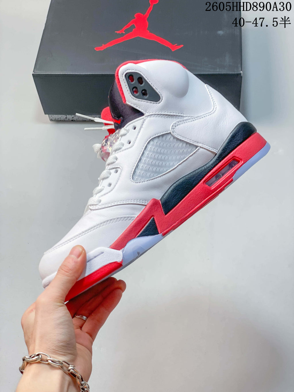 Side profile highlighting the mesh panel, lace area, and layered midsole