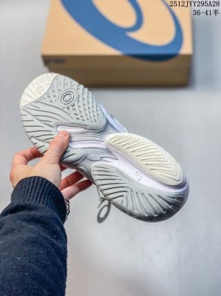 Underside view of the white and light gray ASICS SKY ELITE FF 3 sneaker showing the patterned outsole and layered sole.